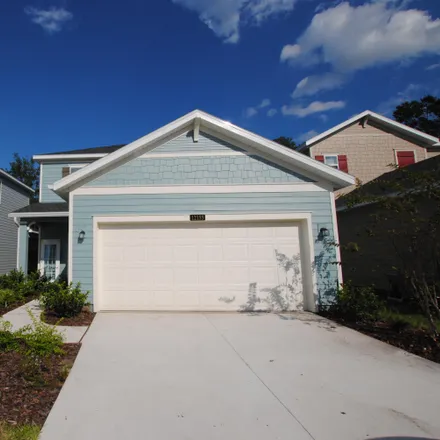 Rent this 4 bed house on Porter Lakes Drive in Jacksonville, FL 32218