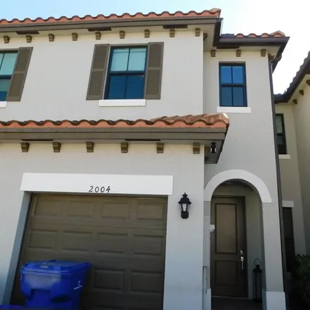 Buy this 3 bed townhouse on Oysterwood Lane in Riviera Beach, FL 33403