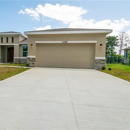 Rent this 3 bed house on 1346 Palau Street Southeast in Palm Bay, FL 32909