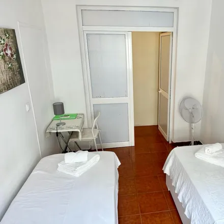 Rent this 6 bed room on Rua Carrilho Videira in 1170-347 Lisbon, Portugal