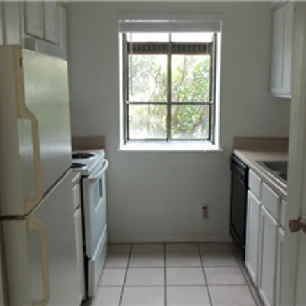 Rent this 2 bed townhouse on 8705 Schick Road in Austin, TX 78729