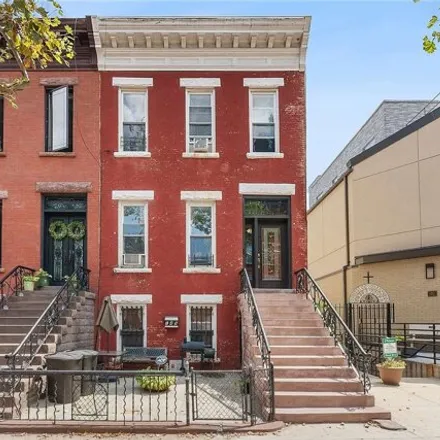 Buy this 5 bed townhouse on 149 Patchen Avenue in New York, NY 11221