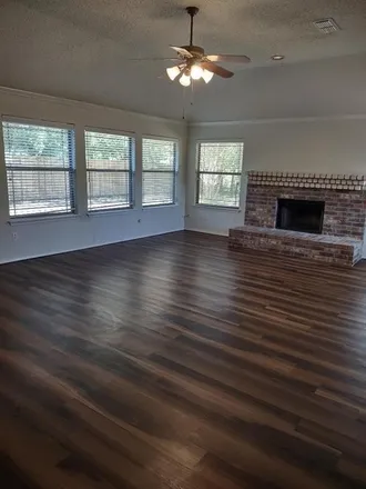 Rent this 4 bed house on 406 North Trail Street in Crowley, TX 76036