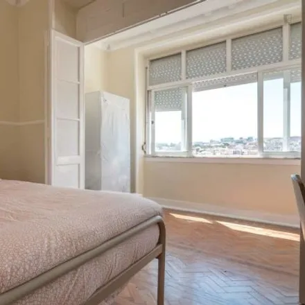 Rent this 4 bed room on Rua Damasceno Monteiro 59 in 1170-108 Lisbon, Portugal