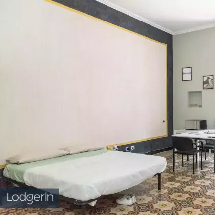 Rent this studio room on Via Napoleone III in 72, 00185 Rome RM