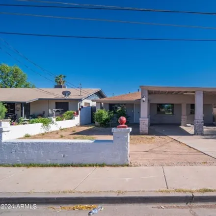 Buy this 4 bed house on 6135 W Lawrence Rd in Glendale, Arizona