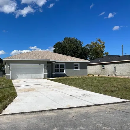 Buy this 4 bed house on 673 Parakeet Court in Polk County, FL 34759