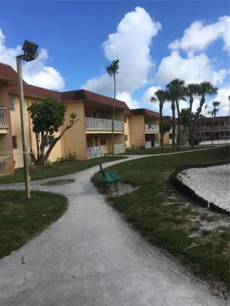 Buy this 2 bed condo on 852 East Commercial Boulevard in North Andrews Gardens, Broward County