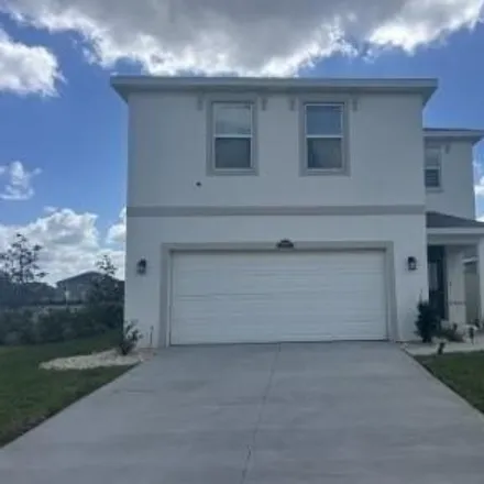 Rent this 4 bed house on 31284 Penny Surf Loop in Wesley Chapel, Florida