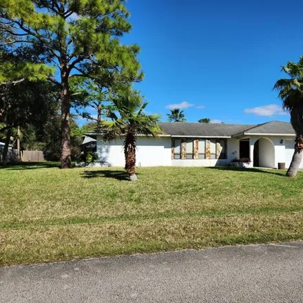 Rent this 4 bed house on 819 Huntington Street Northeast in Palm Bay, FL 32907