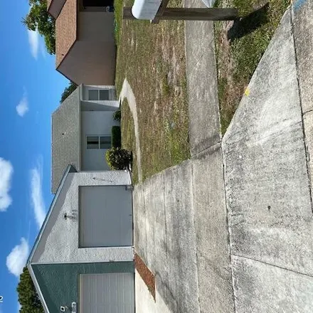 Rent this 3 bed house on 1696 Owl Lane in Melbourne, FL 32935