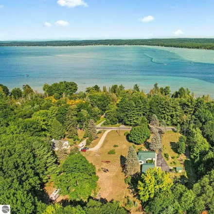 Buy this 2 bed house on 11899 Southwest Torch Lake Drive in Milton Township, MI 49676