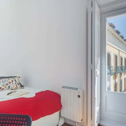 Rent this 7 bed room on Calle de la Sal in 2, 28012 Madrid