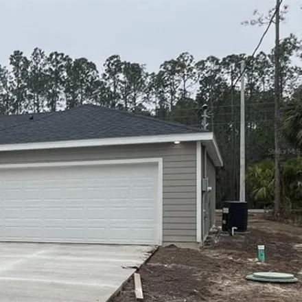 Buy this 4 bed house on 42 Slipper Orchid Trail East in Palm Coast, FL 32164