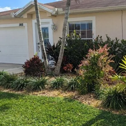 Rent this 3 bed house on 1420 Southwest Bartell Avenue in Port Saint Lucie, FL 34953