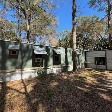 Buy this studio apartment on 84 Gladys Court in Inglis, Levy County