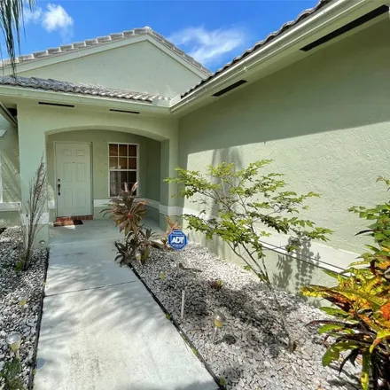 Rent this 4 bed house on 1642 Northwest 143rd Way in Pembroke Pines, FL 33028