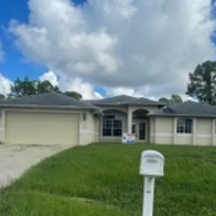 Rent this 3 bed house on 2602 16th Street West in Lehigh Acres, FL 33971