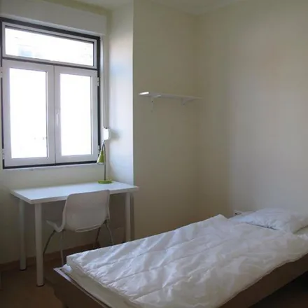 Rent this 4 bed room on Rua Sebastião Saraiva Lima 50 in 1170-347 Lisbon, Portugal