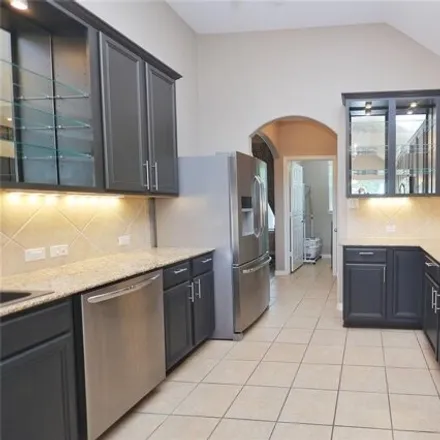 Buy this 4 bed house on 9643 Whittington Park Lane in Canyon Lakes at Stonegate, Harris County