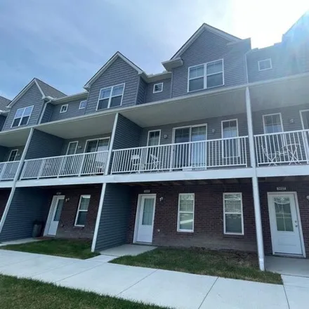 Rent this 2 bed townhouse on Trailway Commons Circle in Auburn Hills, MI 48309