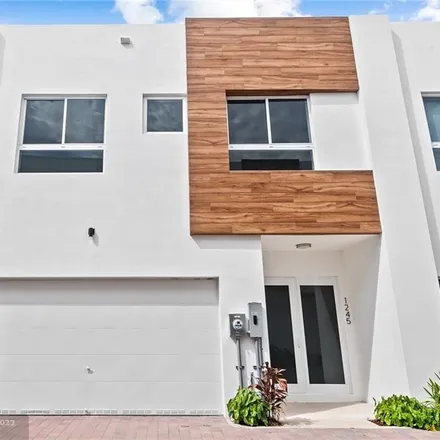 Buy this 3 bed townhouse on 1245 Northeast 18th Avenue in Fort Lauderdale, FL 33304