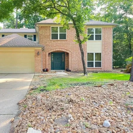 Rent this 4 bed house on 2 Firewillow Pl in Spring, Texas