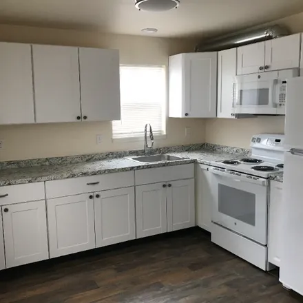 Rent this 3 bed apartment on 511 1/2 E 1st St