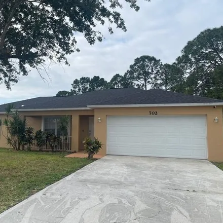 Rent this 3 bed house on 702 Nw Kilpatrick Ave in Port Saint Lucie, Florida