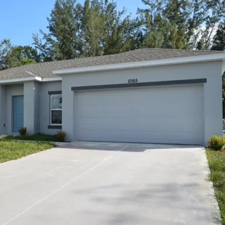 Rent this 4 bed house on Garvey Road Southwest in Palm Bay, FL 32908