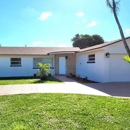 Rent this 4 bed house on 5140 Kathy Lane in Palm Beach County, FL 33415