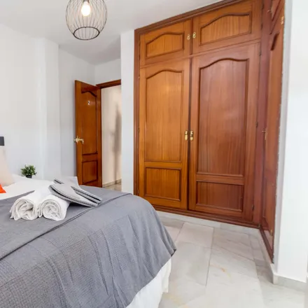 Rent this 4 bed room on Calle Martínez de la Rosa in 153, 29010 Málaga