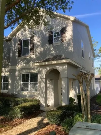 Rent this 3 bed townhouse on 12246 Langstaff Drive in Lakeside Village, FL 34786