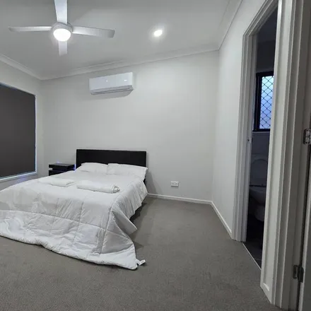 Rent this 4 bed house on Park Ridge QLD 4125