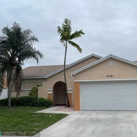 Rent this 3 bed house on 2699 Tahoe Way in Miramar, FL 33025