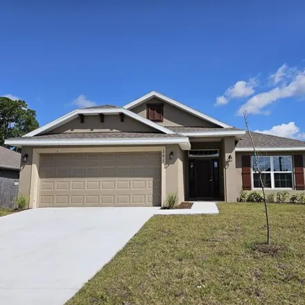 Buy this 4 bed house on 249 Hoffer Avenue Northwest in Palm Bay, FL 32907