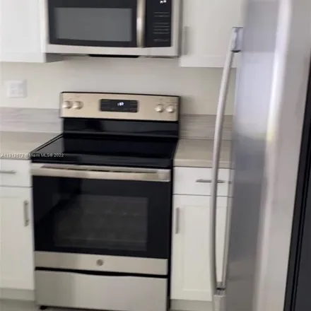 Rent this 3 bed apartment on West 32nd Lane in Hialeah, FL 33018