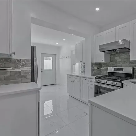 Rent this 4 bed house on 24-49 37th Street in New York, NY 11103