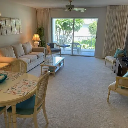 Rent this 2 bed condo on 1299 North Sugar Sandy Boulevard in Palm Beach Isles, Riviera Beach