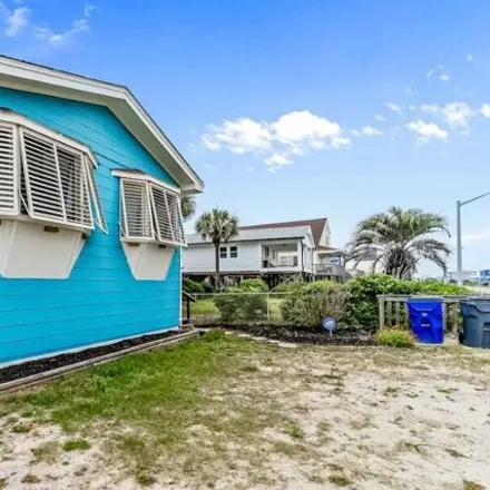 Buy this 4 bed house on 2504 E Beach Dr in Oak Island, North Carolina
