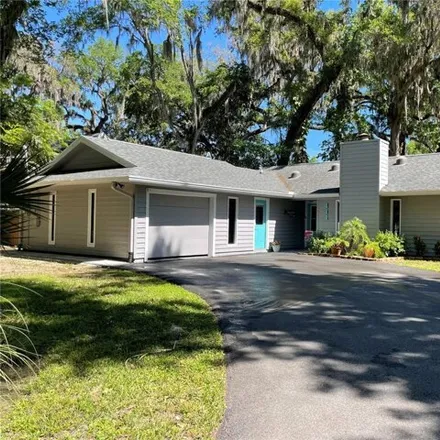 Buy this 4 bed house on 411 Wildwood Drive in New Smyrna Beach, FL 32168