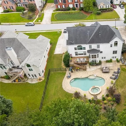 Buy this 6 bed house on 2401 Wood Creek Court Northeast in Gwinnett County, GA 30019