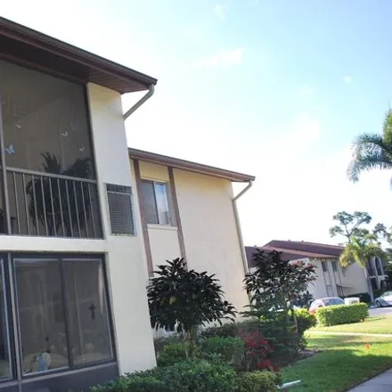 Rent this 2 bed condo on 330 Knotty Pine Circle in Greenacres, FL 33463