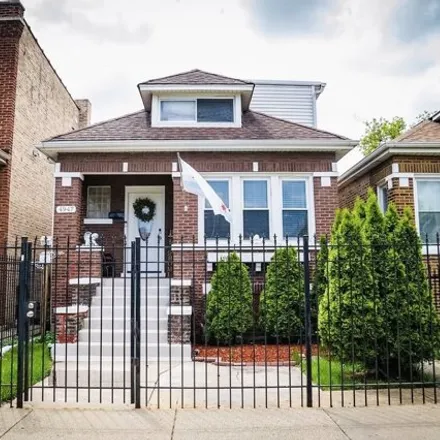Buy this 4 bed house on 4945-4947 West Kamerling Avenue in Chicago, IL 60651