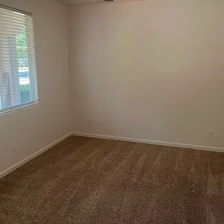 Rent this 4 bed apartment on 3121 Browning Avenue in Clovis, CA 93619