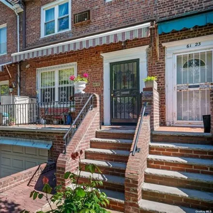 Buy this 3 bed townhouse on 61-21 Alderton St in Rego Park, New York