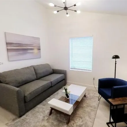 Rent this 1 bed condo on 840 SW 7th St