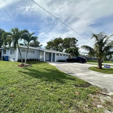 Rent this 4 bed house on 686 Northwest 39th Street in Lloyds Estates, Broward County