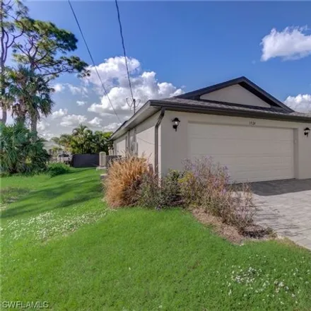 Buy this 4 bed house on 3546 Northeast 13th Avenue in Cape Coral, FL 33909