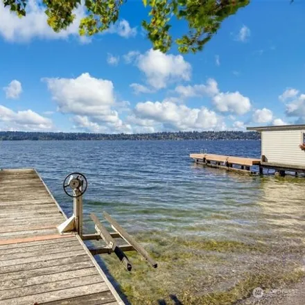 Buy this 3 bed house on 11531 Holmes Point Drive Northeast in Manitou, Kirkland